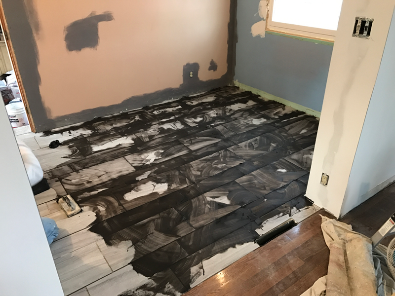 Grouting the kitchen floor. Wasn’t scary at all. But I love the black grout now that it’s done.